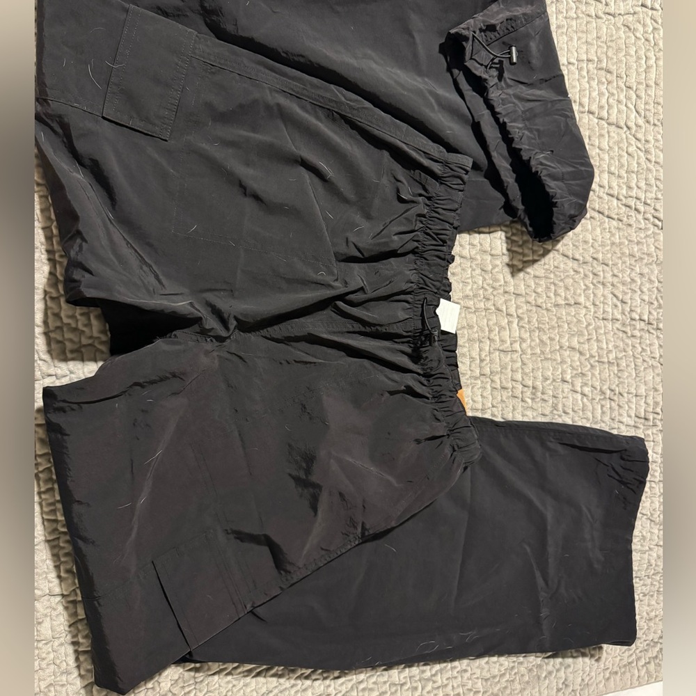 Black parachute pants from pink